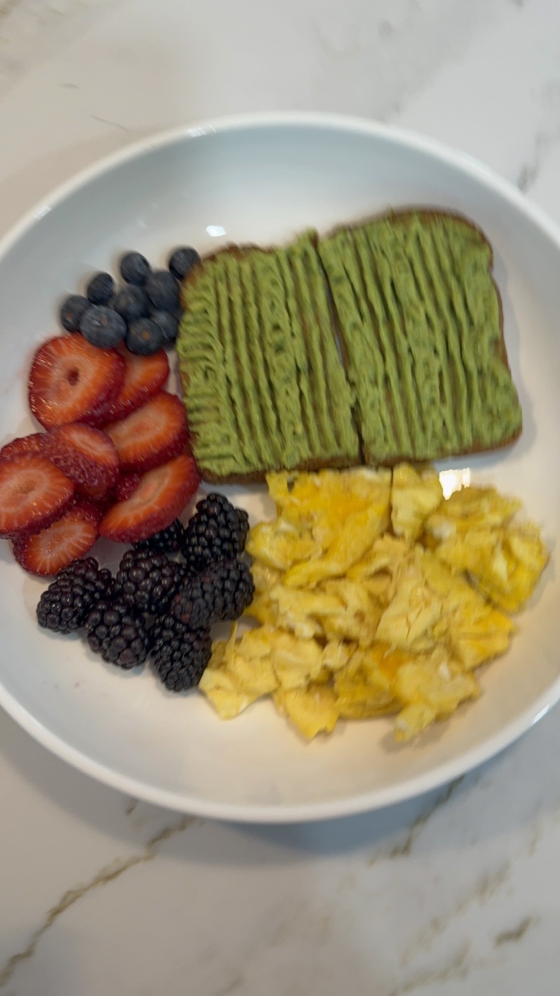 Avocado toast with eggs and fresh berries